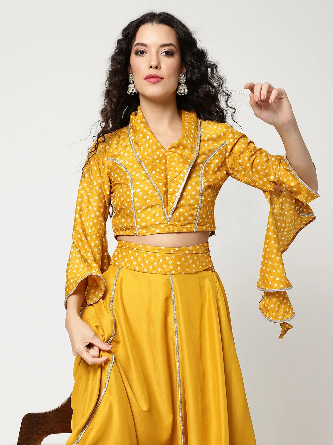 Bandhani Foil Printed Collared Crop Top Having Laces With Bell Sleeves And Solid Matching Flared Skirt Set Silk Blend Satin Velvet